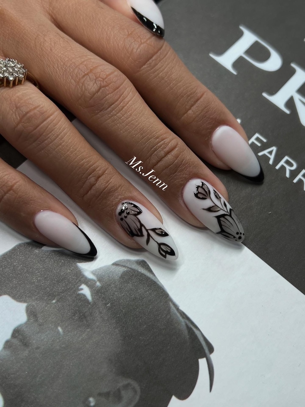 Black floral nail design by Ms. Jenn