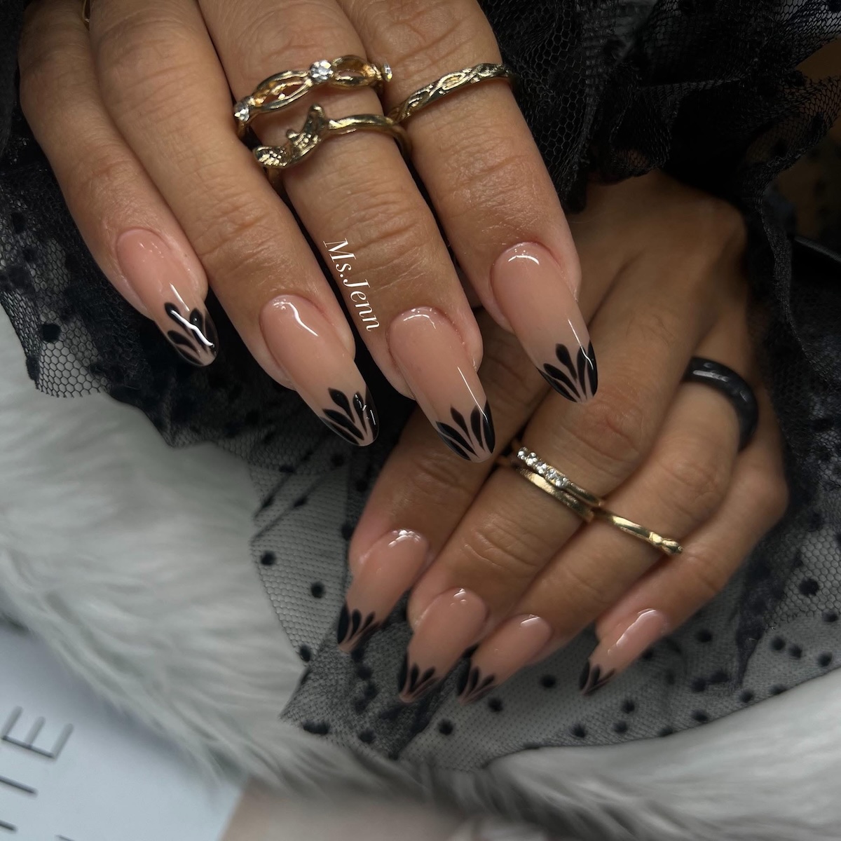 Black flower nail art by Ms. Jenn